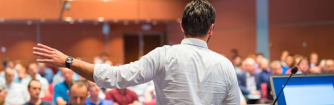 A university lecturer giving a lecture to students